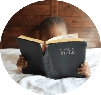 Little boy reading the Bible